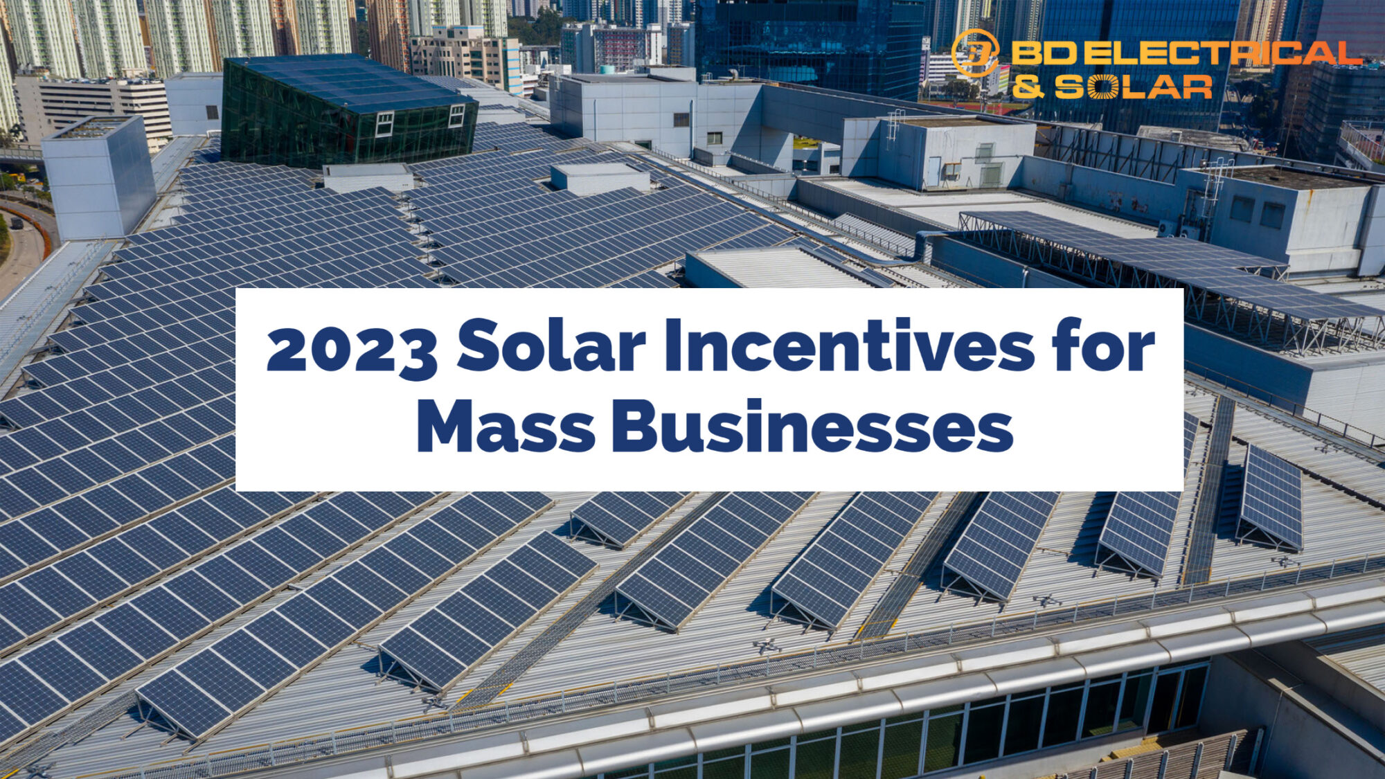 Picture of solar panels on commercial business with the text "2023 Solar Incentives for Mass Businesses"