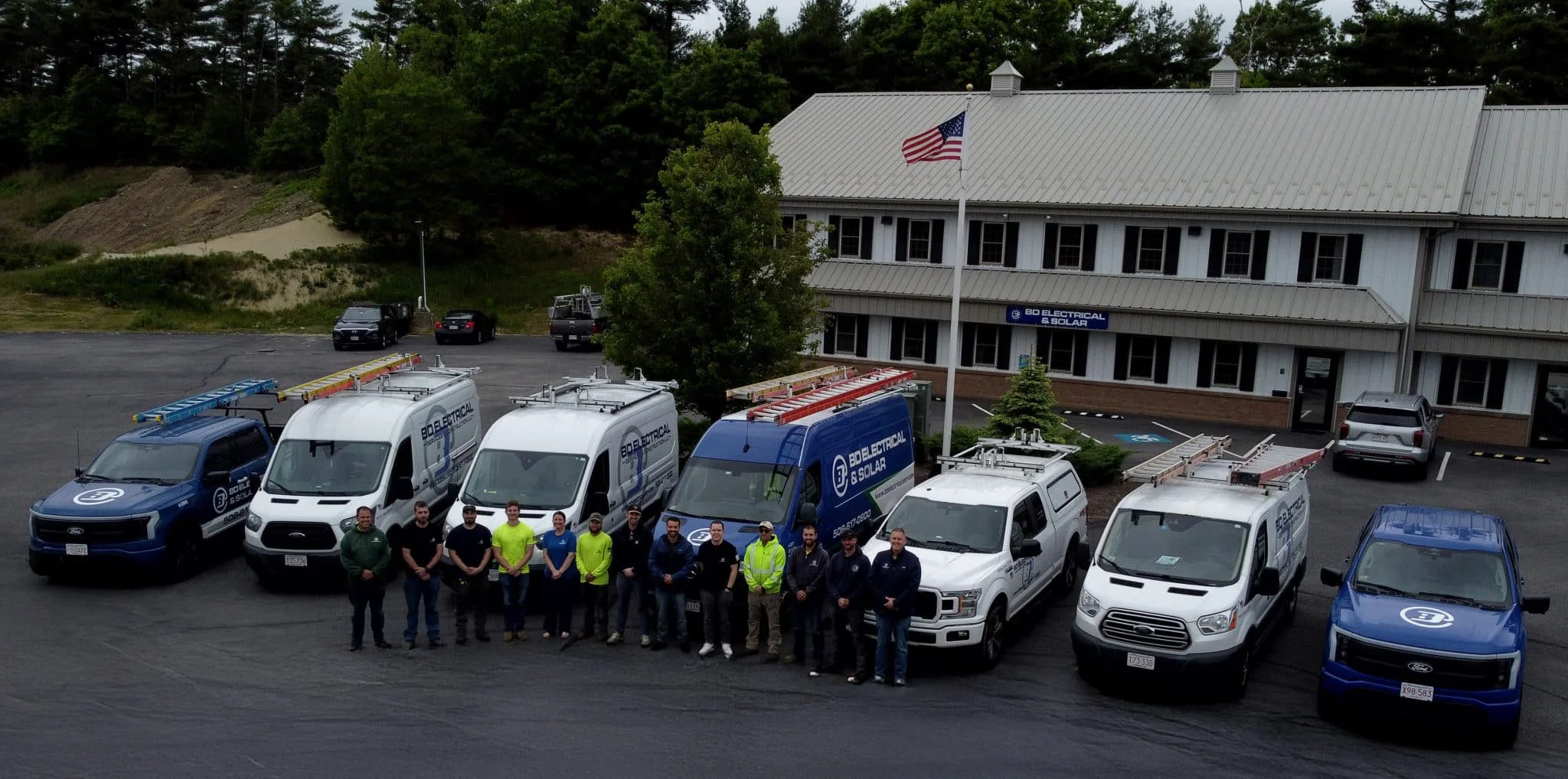 BD Electrical and Solar team with company service vehicles