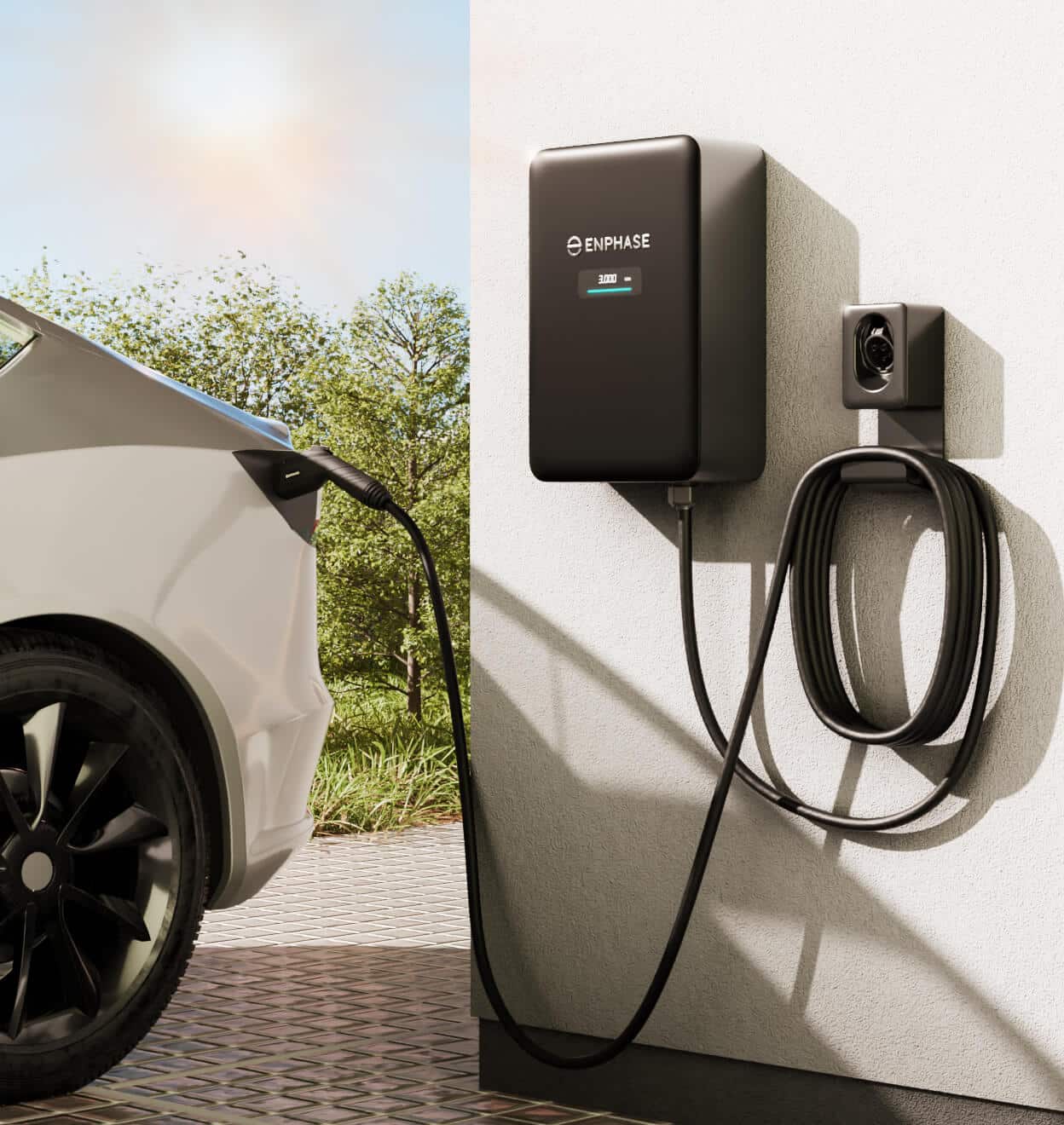 Enphase EV charger mounted on wall, connected to electric vehicle, set in outdoor environment with greenery, showcasing energy-efficient charging solution.
